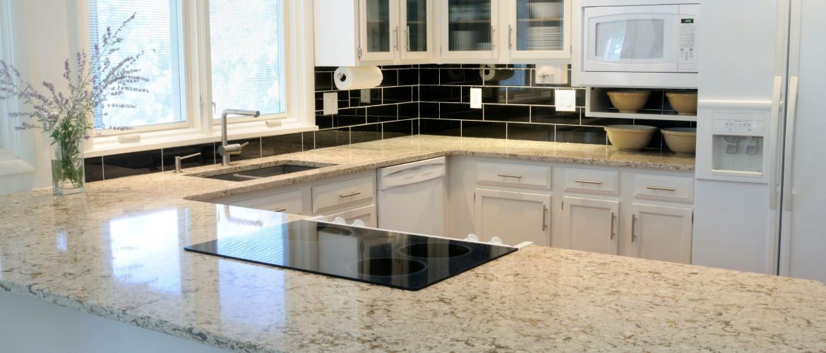 Beige granite countertops with warm white cabinets in a Chicago kitchen remodel
