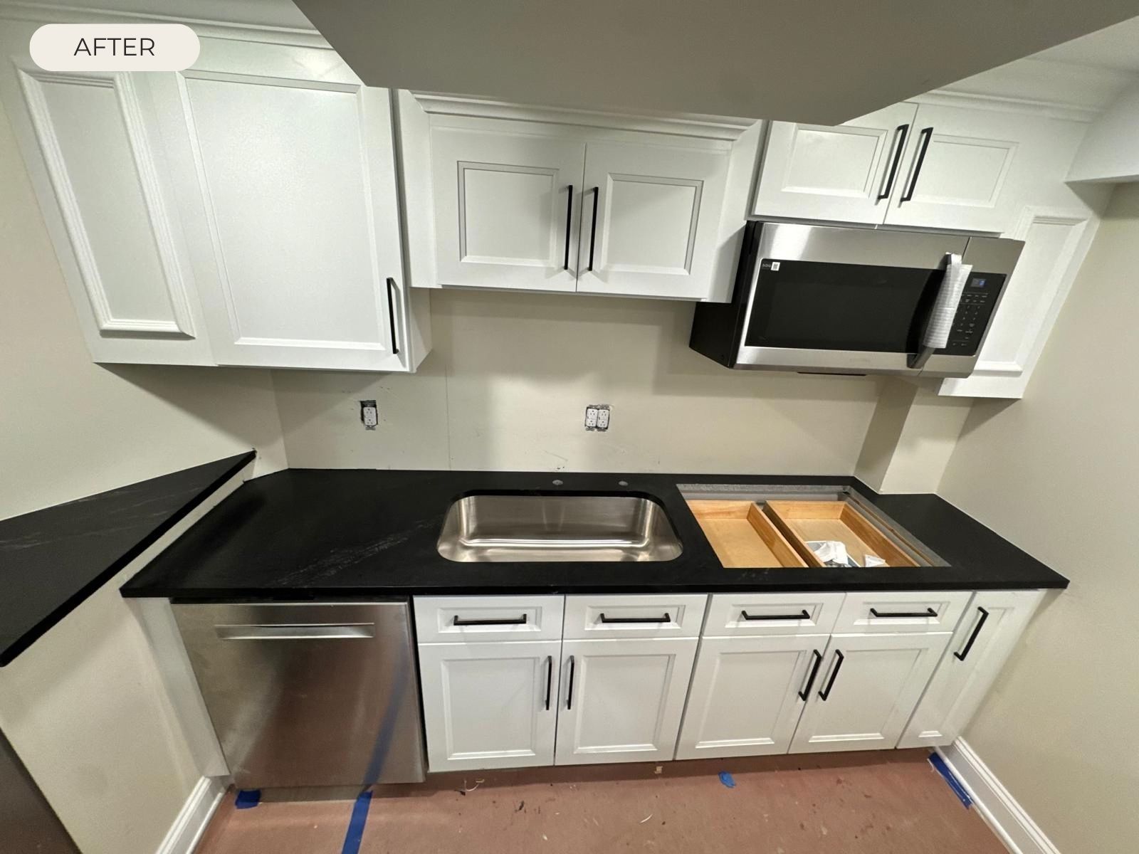 kitchen-countertop-after-installation Black kitchen countertop installed with undermount sink and white cabinets